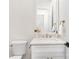 Elegant half bathroom featuring herringbone backsplash, marble countertop, and modern fixtures at 1534 Easy St, Belmont, NC 28012