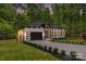 Beautiful brick home boasting a modern garage, lush lawn, and well-maintained landscaping at 1534 Easy St, Belmont, NC 28012
