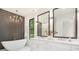 Spa-like main bathroom featuring a freestanding tub, dual vanities, and modern lighting at 1534 Easy St, Belmont, NC 28012