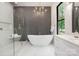 Bright main bathroom features a glass shower, soaking tub, and stylish fixtures at 1534 Easy St, Belmont, NC 28012