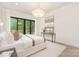 Bright and spacious main bedroom with stylish lighting, ensuite bath and deck access at 1534 Easy St, Belmont, NC 28012
