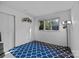 Bright bedroom featuring a large window and a unique blue patterned rug at 1832 J Julian Ln, Charlotte, NC 28208