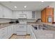 Bright kitchen with white cabinets, countertops, and modern appliances at 1832 J Julian Ln, Charlotte, NC 28208