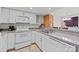 Well-lit kitchen with white cabinets, modern appliances, and countertop space at 1832 J Julian Ln, Charlotte, NC 28208