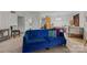 Cozy living room featuring a blue couch and views into the kitchen at 1832 J Julian Ln, Charlotte, NC 28208