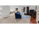Open-concept living room with carpet flooring, lots of natural light, and adjacent dining area at 1832 J Julian Ln, Charlotte, NC 28208