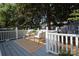 Inviting deck with seating and a neutral rug, perfect for outdoor relaxation at 1904 Lynnwood Dr, Charlotte, NC 28209