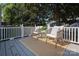 Serene deck featuring comfortable seating with decorative pillows and a patterned rug at 1904 Lynnwood Dr, Charlotte, NC 28209