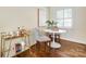 Stylish breakfast nook featuring hardwood floors, natural light, and a modern bar cart at 1904 Lynnwood Dr, Charlotte, NC 28209