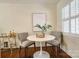 Cozy breakfast nook featuring hardwood floors, natural light, and a modern bar cart at 1904 Lynnwood Dr, Charlotte, NC 28209