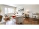Cozy living room featuring hardwood floors, neutral decor, plantation shutters, and comfortable seating at 1904 Lynnwood Dr, Charlotte, NC 28209