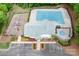 Aerial view of the community clubhouse, pool, playground, and parking area at 1916 Pine Mountain Rd, Charlotte, NC 28214