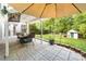 Charming backyard featuring a paver patio, seating area, and a storage shed at 1916 Pine Mountain Rd, Charlotte, NC 28214