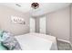 Bedroom with neutral walls and carpet, featuring a bed and two white doors at 1916 Pine Mountain Rd, Charlotte, NC 28214