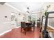 Elegant dining room with wood floors, a stylish table, decoratively placed shelves, and views to the kitchen at 1916 Pine Mountain Rd, Charlotte, NC 28214