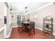 Elegant dining room with wood floors, a stylish table, and decoratively placed plants with decoratively placed shelves at 1916 Pine Mountain Rd, Charlotte, NC 28214