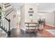 Inviting entryway with dark tile flooring, staircase, table, and views of dining and kitchen at 1916 Pine Mountain Rd, Charlotte, NC 28214