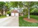 Charming two-story brick and siding home with a well-manicured lawn and a two-car garage at 1916 Pine Mountain Rd, Charlotte, NC 28214