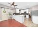 Bright kitchen featuring white cabinets, stainless steel appliances, and a sliding barn door at 1916 Pine Mountain Rd, Charlotte, NC 28214
