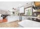 Modern kitchen with white cabinets, stainless steel appliances, and open view to living room at 1916 Pine Mountain Rd, Charlotte, NC 28214