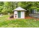 Well-maintained backyard storage shed with a green door, providing extra storage space at 1916 Pine Mountain Rd, Charlotte, NC 28214