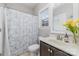 Cozy bathroom with a shower curtain, a window with blinds and traditional fixtures at 2041 Topaz Plz, Davidson, NC 28036