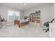 Comfortable bedroom with neutral carpet, natural light, and a bookshelf at 2041 Topaz Plz, Davidson, NC 28036
