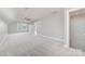 Spacious bonus room offers recessed lighting, carpeted floors, and a ceiling fan at 2041 Topaz Plz, Davidson, NC 28036