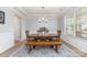 Elegant dining room featuring wood table, bench, chandelier, and natural light, creating a warm atmosphere at 2041 Topaz Plz, Davidson, NC 28036