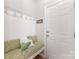 Cozy entryway with bench seating, decorative hooks, and stylish decor at 2041 Topaz Plz, Davidson, NC 28036