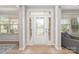 Welcoming front foyer with natural light, glass paneled door, and hardwood floors, creating a grand entrance at 2041 Topaz Plz, Davidson, NC 28036