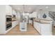 Bright kitchen with white cabinets, stainless appliances, granite counters, and hardwood floors at 2041 Topaz Plz, Davidson, NC 28036