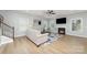 Cozy living room with a fireplace, ceiling fan, and bright windows; perfect for relaxation and entertaining at 2041 Topaz Plz, Davidson, NC 28036
