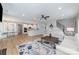 Open-concept living area with hardwood floors flows into the dining and kitchen areas at 2041 Topaz Plz, Davidson, NC 28036