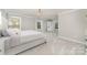 Large and stylish main bedroom with plush carpeting, large windows, and modern decor at 2041 Topaz Plz, Davidson, NC 28036