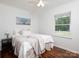 Bedroom with neutral decor, a soft throw blanket and a large window offering natural light at 2054 Hickory Hills Dr, Denver, NC 28037