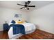 Comfortable bedroom features hardwood floors, soft lighting, and calm decor at 2054 Hickory Hills Dr, Denver, NC 28037