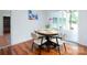 Cozy dining area with view of pool, featuring a round table and stylish chairs at 2054 Hickory Hills Dr, Denver, NC 28037