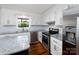 Bright kitchen with white cabinetry, granite countertops, and stainless-steel appliances at 2054 Hickory Hills Dr, Denver, NC 28037