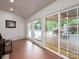 Bright living room with a view of the pool and back deck through large sliding glass doors at 2054 Hickory Hills Dr, Denver, NC 28037