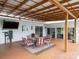 Inviting covered patio featuring outdoor dining set, perfect for enjoying meals outdoors at 2054 Hickory Hills Dr, Denver, NC 28037