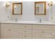 Elegant bathroom featuring a double sink vanity with ornate mirrors and decorative lighting fixtures at 2126 Norton Rd, Charlotte, NC 28207