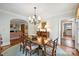 Charming dining room with hardwood floors and archway views of the living areas at 2126 Norton Rd, Charlotte, NC 28207