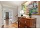 Bright hallway featuring hardwood floors, traditional decor, and access to rooms at 2126 Norton Rd, Charlotte, NC 28207