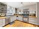 Charming kitchen featuring stainless steel appliances, wood countertops, and ample cabinet space at 2126 Norton Rd, Charlotte, NC 28207