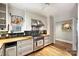 Well-lit kitchen showcasing stainless steel appliances, wood countertops, and ample storage at 2126 Norton Rd, Charlotte, NC 28207