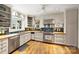 Charming kitchen featuring stainless steel appliances, wood countertops, and ample cabinet space at 2126 Norton Rd, Charlotte, NC 28207