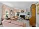 Comfortable living room featuring a marble fireplace, stylish decor, and natural light from large windows at 2126 Norton Rd, Charlotte, NC 28207