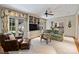 Spacious living room featuring built-in shelving, comfortable seating, and access to the outdoors at 2126 Norton Rd, Charlotte, NC 28207