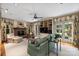 Bright living room featuring a fireplace, built-in shelving, and French doors to the outside at 2126 Norton Rd, Charlotte, NC 28207